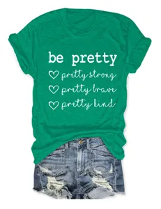 Casual groen dames t-shirt met korte mouwen en inspirerende slogan print, comfortabel ronde hals detail.