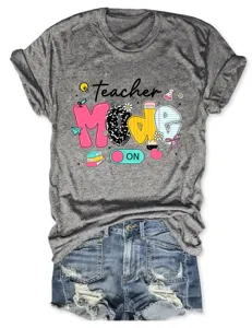 Grey short sleeve t-shirt with teacher mode on print and denim shorts detail view