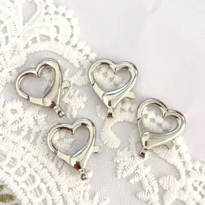 Silver heart lobster clasp detail shot, metal spring keychain DIY accessory pendant close up
