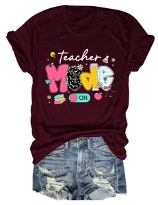 Detailed view of casual burgundy short sleeve t-shirt featuring teacher graphic print design.