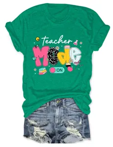 Teacher mode on casual round neck short sleeve green t-shirt detailed view with denim shorts.