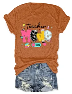 Teacher mode on graphic t-shirt detail showing vibrant typography and cute school icons.
