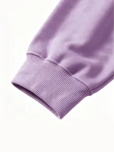 Close-up detail of kids purple sweatshirt rib cuff, soft cotton fabric texture view.
