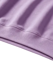 Detailed view of kids purple solid color sweatshirt hem, soft ribbed cuff fabric texture.