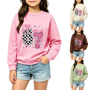 Close-up detail of the kids long-sleeve graphic sweatshirt showcasing cute birthday print.