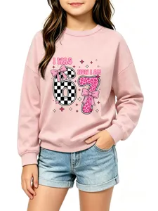 Kids pink long sleeve sweatshirt detail view showing cute graphic print and soft fabric.