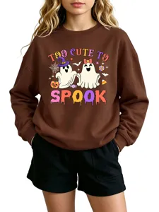 Detailed view of the funny Halloween ghost graphic printed on the brown kids sweatshirt.