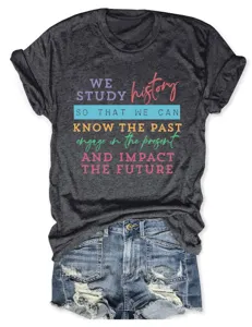 Close-up detail of the dark grey graphic t-shirt showing colorful letter print and soft fabric.