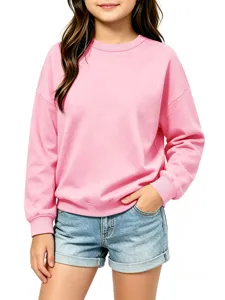 Kids solid pink long sleeve crewneck sweatshirt detailed view showing soft fabric and cuffs.