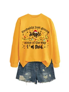 Women's yellow crewneck long sleeve sweatshirt with funny Christmas letter print and blue shorts.