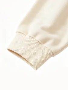Close-up shot of comfortable solid color ribbed sleeve cuff, soft texture detail view