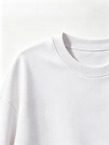 Close-up detail of children's solid color crewneck long sleeve sweatshirt in white.