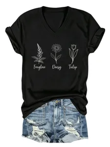 Stijlvol zwart dames t-shirt met V-hals en korte mouwen voorzien van bloemenprint