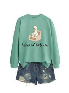 Casual fashion women's duck graphic sweatshirt paired with distressed denim shorts for daily wear.
