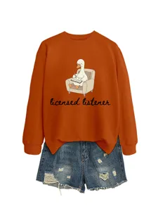 Women casual orange sweatshirt with cute duck graphic print paired with stylish denim shorts set.