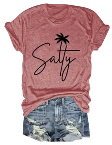 Casual women's round neck short sleeve t-shirt with salty palm tree print paired with denim shorts.