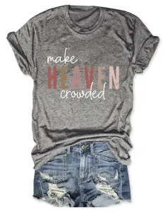 Close-up of the heather grey graphic t-shirt with letter print and distressed denim shorts.