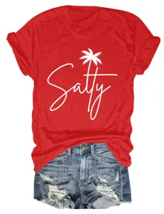Detail view of red short sleeve t-shirt with salty palm tree print and denim shorts.