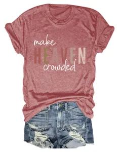Close-up of heather red short sleeve tee shirt with printed slogan paired with distressed denim shorts.