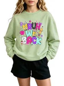 Green crewneck sweatshirt with fun back to school graphic print for women and teens casual wear.
