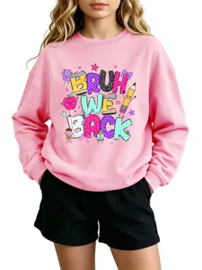 Detailed view of the pink long-sleeve sweatshirt with back-to-school cartoon graphic print.