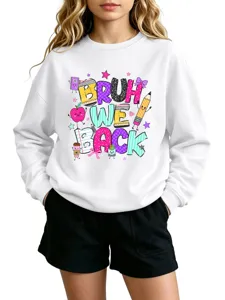 Detailed close-up view of the cute cartoon print design on the white kids crewneck sweatshirt.