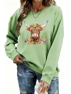 Casual light green women's sweatshirt featuring a cute highlander cow floral graphic print detail.