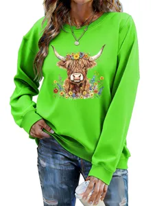 Detail view of casual women green sweatshirt featuring highland cow floral graphic print.