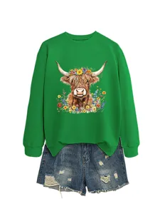Women casual green sweatshirt featuring cute highland cow floral print with denim shorts.