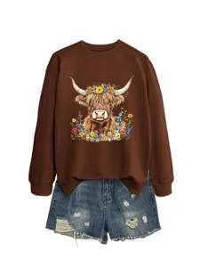 Details of the brown long-sleeve sweatshirt with cute highland cow floral print and denim shorts.