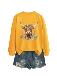 Women casual yellow sweatshirt with highland cow floral print and denim shorts set.