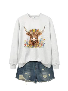 Cute highland cow floral print crewneck sweatshirt paired with distressed denim shorts.