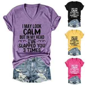 Close-up of casual women's V-neck short sleeve t-shirt with funny text detail view.