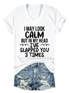 Casual white V-neck short sleeve t-shirt with funny letter print paired with denim shorts.