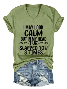 Close-up detail of the funny slogan graphic printed on the casual olive green V-neck T-shirt.