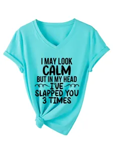 Close-up detail of the turquoise V-neck short sleeve t-shirt with funny quote print.
