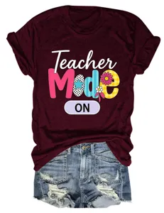 Detailed closeup of casual women maroon short sleeve t-shirt featuring teacher graphic print.