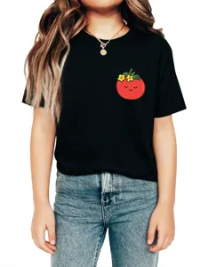 Close-up of a cute cartoon tomato and flower graphic print on a stylish black short sleeve tee.
