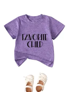 Close-up detail of the purple heather children t-shirt with letter print and matching white shoes.