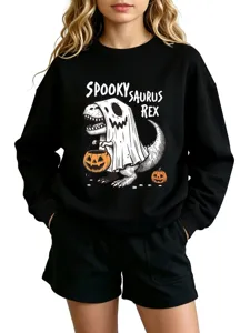 Close-up view of the Halloween spooky saurus rex graphic print on soft black cotton sweatshirt.
