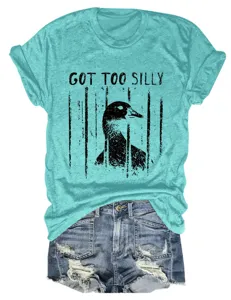 Casual women's turquoise short sleeve t-shirt with funny goose graphic and denim shorts.