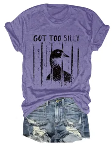 Casual purple short sleeve t-shirt detail featuring a funny caged duck graphic and text print.