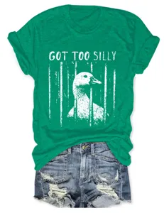 Detailed view of the casual green graphic t-shirt featuring a funny caged duck print.