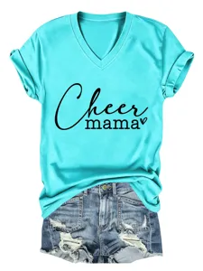 Close up detail view of turquoise v-neck short sleeve t-shirt with text print and denim shorts.