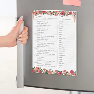 Bloc-notes magnétique de planification de repas hebdomadaire avec liste de courses et fleurs.