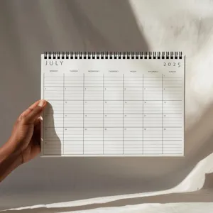 Minimalist 2025 monthly calendar planner desk schedule notepad with spiral binding design.