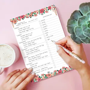 Bloc-notes magnétique de planification de repas hebdomadaire avec motif floral et liste.