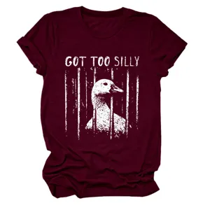 Women's casual maroon short sleeve t-shirt featuring a funny caged duck graphic and text.