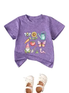 Close-up detail of the purple kids t-shirt with cute garden gnome and cartoon flower graphic.