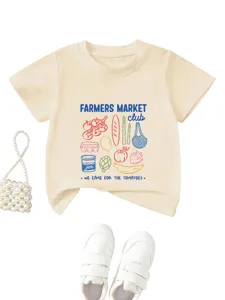 Kids beige short sleeve t-shirt featuring farmers market graphic print detail shot.